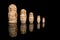 Wooden Russia matrioshka dolls in a row on a blackground