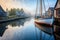 wooden sailboat docked in serene harbor setting