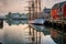 wooden sailboat docked in serene harbor setting