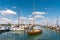 Wooden sailboat preparing to enter a berth in Konstanz harbor and docking