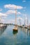 Wooden sailboat preparing to enter a berth in Konstanz harbor and docking