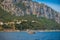 Wooden sailing yacht sails near the island of Capri