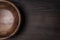 Wooden salad bowl on brown table