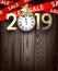 Wooden sale 2019 background with gold clock and ribbons.