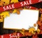 Wooden sale background with maple leaves.