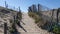 Wooden sandy pathway stairs access to Cap-Ferret sea beach in gironde france