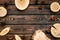 Wooden sawcut and pine cone frame for blog on rustic background top view mockup