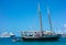 A wooden schooner anchored off a pristine beach on christmas day