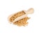 Wooden scoop with aromatic mustard seeds on white background
