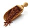 Wooden scoop with cocoa powder