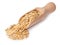 Wooden scoop with oat grains