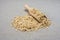 Wooden scoop spoon with Dry rolled oatmeal. Oatmeal flakes. Healthy eating concept. pile of oatmeal. Cooking oats porridge concept