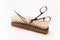 Wooden scrub brush is trimmed by scissors