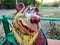 Wooden sculpture on the playground. Smiling bear