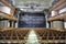 Wooden seats in an empty theater hall