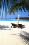 Wooden Seats, Palm Trees and Pacific Ocean in Luxury Maldives Re