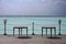 Wooden seats by tropical sea