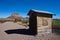 Wooden shacks in desert setting