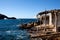 Wooden shacks on rocky coast