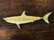 Wooden Shark Sculpture on the vintage wooden table.