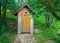 Wooden shed ecological composting toilet on countryside eco farm - Concept image