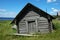 Wooden shed on the lake bank