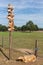 Wooden sheep and pole with arrow signs near Ermelo sheepfold