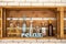 Wooden shelf on a brick wall with decorative bottles
