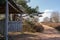 Wooden shelter in heathland with a sandy path