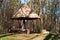 Wooden shelter from the rain at the edge of forest