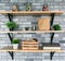 Wooden shelves with different home related objects.