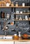 Wooden Shelves with different jars on a black wall with chalk