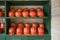 wooden shelving with orange protective helmets. the concept of workplace safety