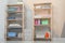 Wooden shelving units with clean towels and detergents