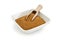 Wooden shovel in bowl of coarse sugar