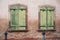 Wooden shutters on stoned facade