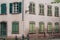 wooden shutters on stoned facade