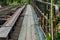 Wooden sidewalk side of railway bridge over the canal