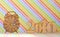 Wooden sign of alarm clock and inscription of 2016 year on rainbow striped background