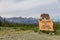 Wooden sign with carved bear welcomes visitors to Haines Junction