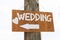 Wooden sign indicates where the wedding
