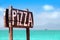 A Wooden Sign of Pizza on the sea coast