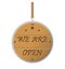 Wooden sign on the rope, the inscription We are open