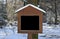 Wooden sign in winter forest, copy space free