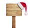 Wooden signboard with Christmas hat