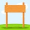 Wooden signboard in grass isolated on grass sky background. Signs board and symbols to communicate a message on street
