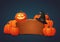 Wooden signboard with smiling halloween pumpkin, witch hat and pile of pumpkins.