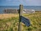 A wooden signpost on a coastal section of the Cleveland Way national trail between Robin Hood`s Bay and Whitby, Yorkshire, UK