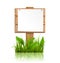 Wooden signpost with grass paper and reflection on white