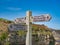 A wooden signpost near Robin Hood`s Bay marks the junction of the Cleveland Way National Trail and the England Coast to Coast pat